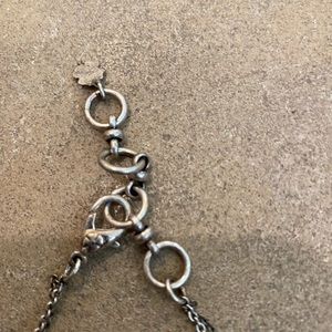 Necklace with crosses and charm